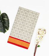 White Handloom Ikat Silk Saree With Contrast Red Border