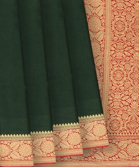 Bottle Green Woven Satin Saree With Floral Motifs In Red Border
