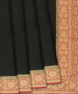 Black Woven Satin Saree With Floral Motifs In Red Border
