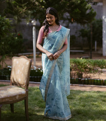 Turquoise Woven Organza Printed Saree With Embroidered Border