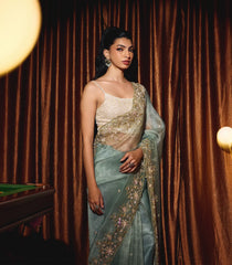 Turquoise Woven Organza Saree With Embroidered Mirror Work & Floral Motifs-EN1809