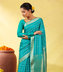 Cyan Crepe Silk Saree With Zari Checks