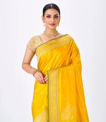 Mustard Handwoven Banarasi Silk Saree With Floral Motifs & Corner Buttas