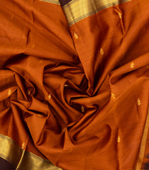 Rust Woven Pure Silk Saree With Zari Buttas & Contrast Border-EC2554
