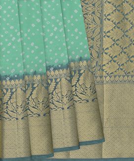 Turquoise Printed Bandhej Silk Saree With Floral Motifs in Border
