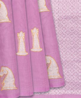 This handwoven kanchipuram silk saree is filled with chess motifs in bubble gum pink body along with zari pallu
