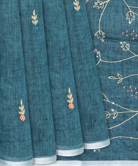 Cyan Handloom Linen Saree With Leaf Embroidery
