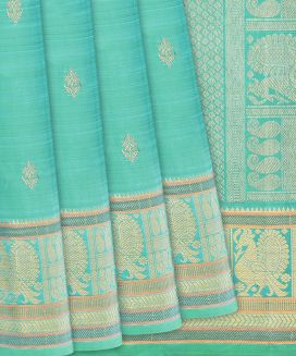 Turquoise Handloom Kanchipuram Silk Saree With Floral Buttas
