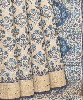 Cream Handloom Printed Tussar Silk Saree With Blue Floral Motifs
