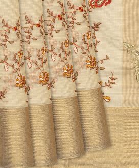 Beige Woven Kota Silk Saree With Embroidered Floral Motifs
