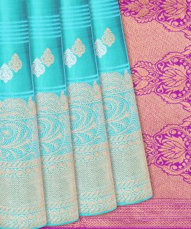 Turquoise Woven Silk Saree With Floral Motifs & Checks
