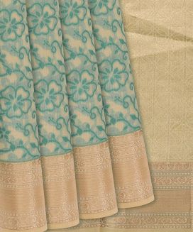Beige Woven Chanderi Cotton Saree With Cyan Floral Motifs

