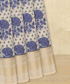 Beige Woven Chanderi Cotton Saree With Blue Floral Motifs
