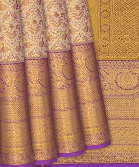 Gold Kanchipuram Tissue Silk Saree With Purple Floral Motifs
