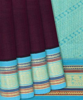Magenta Handloom Silk Cotton Saree with contrast cyan border & pallu
