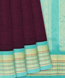Maroon Handloom Silk Cotton Saree with contrast turquoise border and pallu
