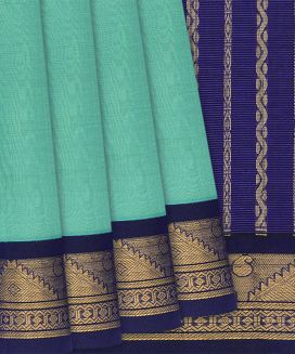 Teal Handloom Silk Cotton Saree with contrast border and pallu
