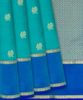 Turquoise Kanchipuram Silk Saree With Peacock motifs and contrast border & pallu
