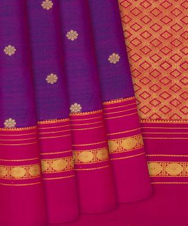 Magenta Kanchipuram Silk Saree With flower motif and contrast Pink border & pallu
