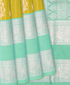 Olive Green Kanchipuram Silk Saree With Floral Buttas and Stripes
