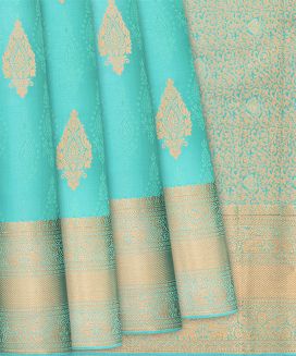 Turquoise Silk Saree With Floral Buttas & Animal Motifs
