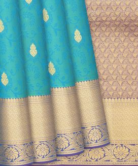 Turquoise Silk Saree With Floral Motifs
