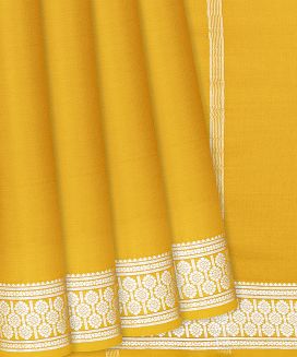 Yellow Plain Mysore Crepe Silk Saree With Floral Motifs Border 
