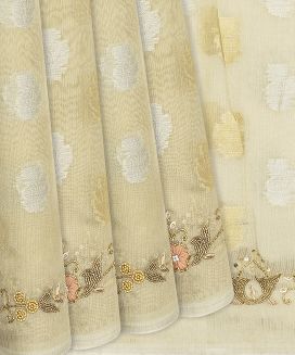 Cream Woven Tissue Saree With Embroidered Floral Motifs
