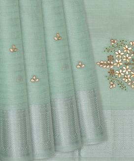 Turquoise Woven Tissue Saree With Embroidered Floral Motifs
