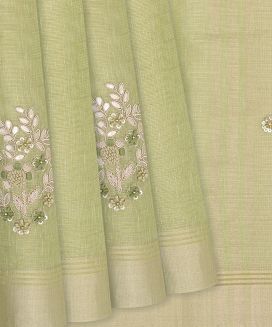 Pista Green Woven Tissue Saree With Embroidered Floral Motifs
