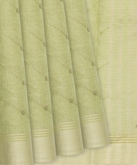 Pista Green Woven Tissue Saree With Embroidered Chevron Motifs
