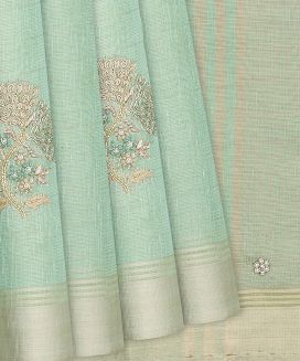 Turquoise Tissue Embroidered Saree With Floral Motifs
