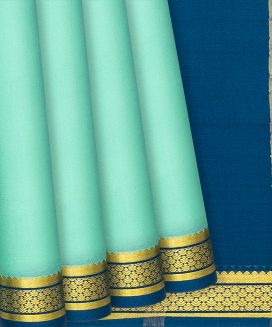 Pista Green Mysore Plain Crepe Silk Saree With Contrast Blue Border
