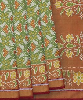 Cardamom Green Handloom Ikat Tissue Silk Saree With Floral Motifs
